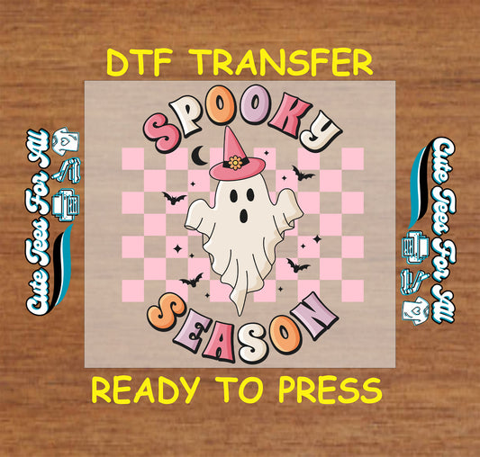 Ghost with pink witch hat, “Spooky Season” text, black bats, and pink checkerboard background

