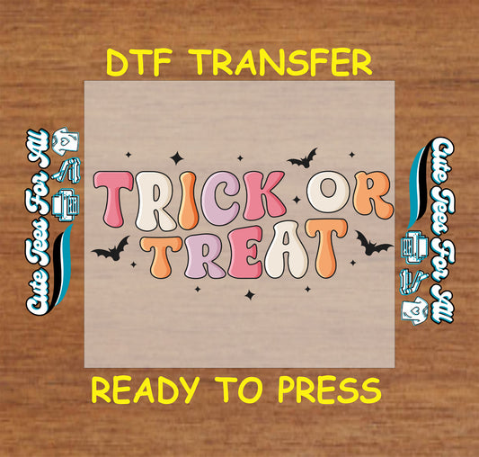 DTF transfer with pastel “Trick or Treat” text, black bats, and sparkles


