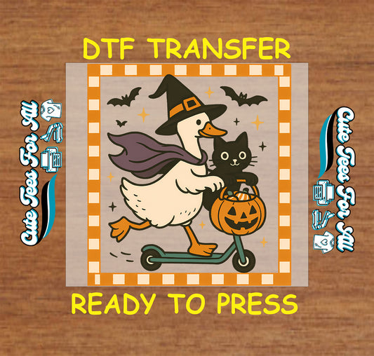 ready to press dtf transfer with witch duck on scooter holding pumpkin bucket and cat

