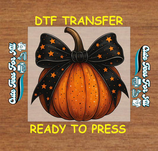 ready to press dtf transfer with orange pumpkin and large black bow with orange stars

