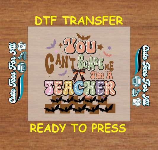 ready to press dtf transfer with retro text you can’t scare me i’m a teacher bats and bow

