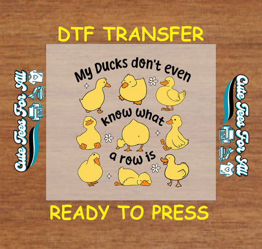 ready to press dtf with cartoon ducks and the funny phrase my ducks don’t know what a row is

