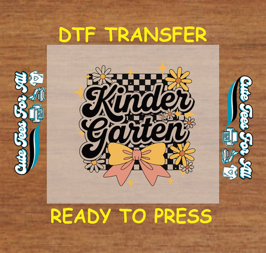 ready to press dtf with kindergarten script, black checkered background, floral accents, and coral yellow bow

