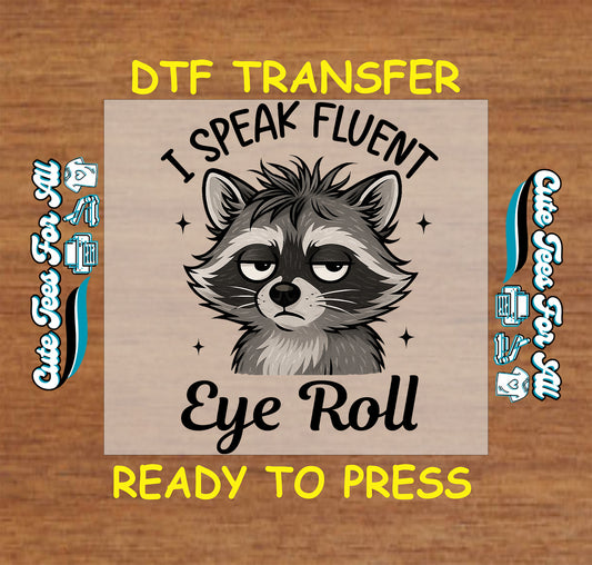 Ready to press dtf transfer with grumpy raccoon and funny phrase "I Speak Fluent Eye Roll" for DIY shirts

