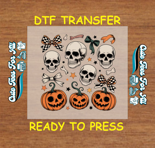 ready to press dtf transfer with skulls, pumpkins, bows, bones, and stars for Halloween DIY shirts

