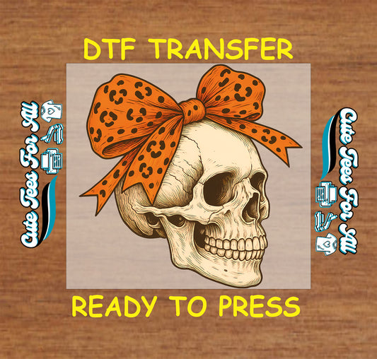 Skull with orange leopard print bow ready to press dtf transfer for DIY shirts

