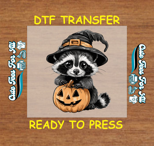 Cute raccoon with witch hat holding jack o’lantern pumpkin ready to press Halloween DTF transfer for DIY shirts