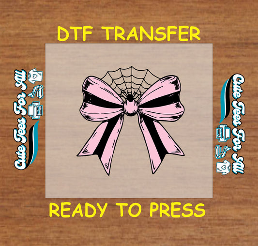 Halloween pink and black striped bow with spiderweb center ready to press dtf transfer
