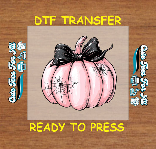 Halloween pink pumpkin with spiderwebs and black bow ready to press dtf transfer