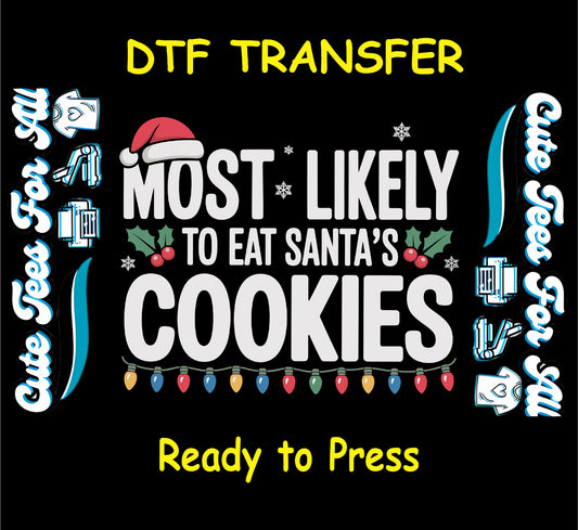 Christmas ready to press DTF transfer with "Most Likely to Eat Santa’s Cookies" text, Santa hat, holly, snowflakes, and Christmas lights.