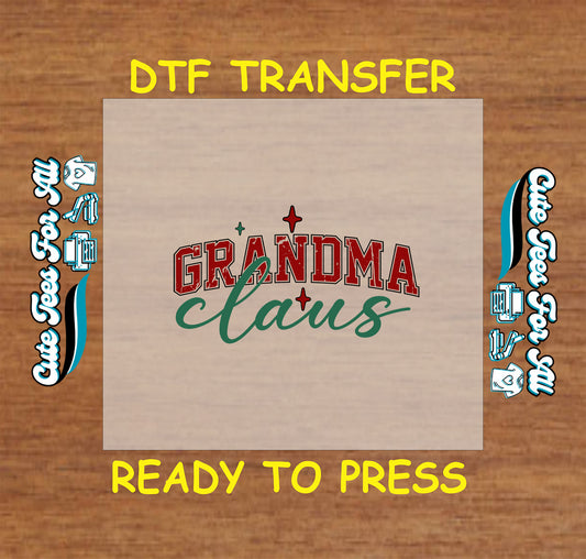Christmas ready to press DTF transfer with retro lettering that says "Grandma Claus" in red and green with holiday star accents.