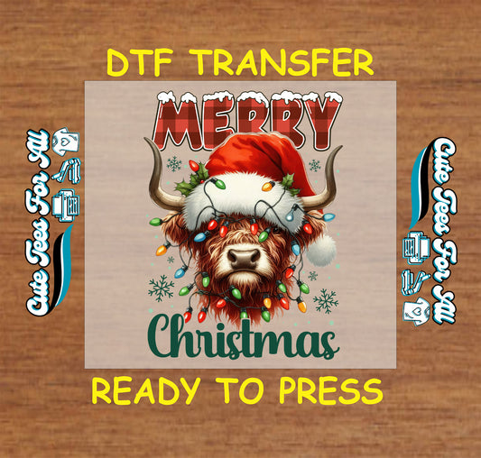 Christmas DTF transfer featuring highland cow wearing Santa hat with colorful Christmas lights and text “Merry Christmas,” ready to press iron on heat transfer for DIY shirts.