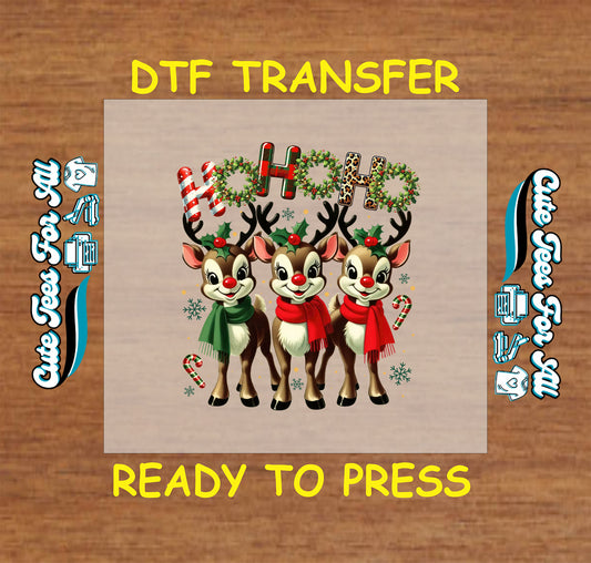 Christmas DTF transfer featuring three reindeer with red and green scarves and text “Ho Ho Ho,” ready to press iron on heat transfer for DIY shirts.