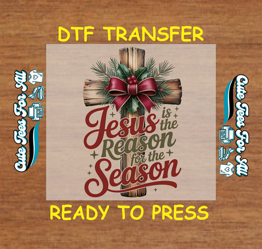 Christmas DTF transfer featuring wooden cross with red bow and text “Jesus Is the Reason for the Season,” ready to press iron on heat transfer for DIY shirts.