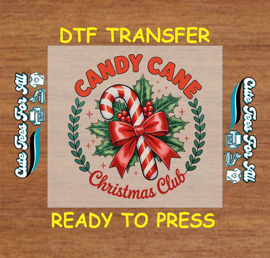 Christmas DTF transfer with “Candy Cane Christmas Club” text and candy cane wrapped in red bow with holly, ready to press iron on heat transfer for DIY shirts.