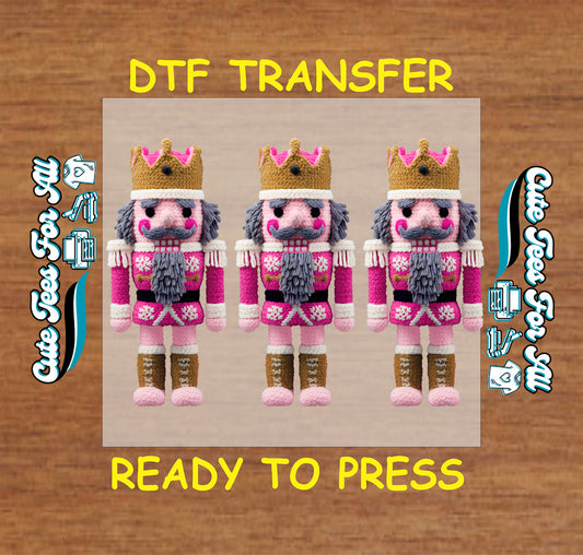 crochet style pink nutcracker trio with yarn texture crowns and festive outfits ready to press dtf iron on heat transfer for diy christmas shirts