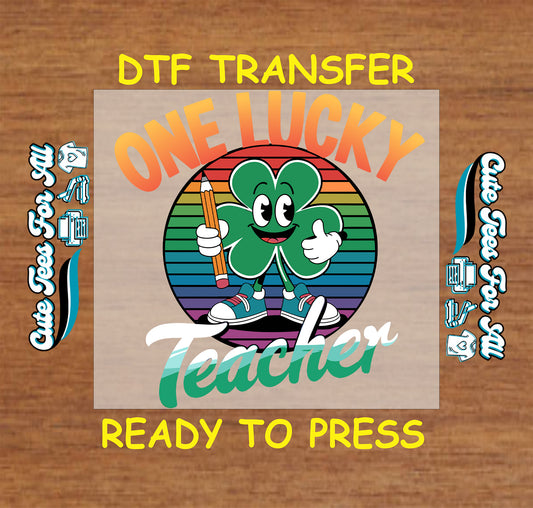 Ready to press dtf St Patricks Day teacher transfer with one lucky teacher text shamrock character and pencil graphic for DIY shirts