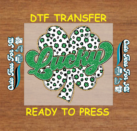 Ready to press dtf St Patricks Day transfer with Lucky text and patterned shamrock graphic for DIY shirts