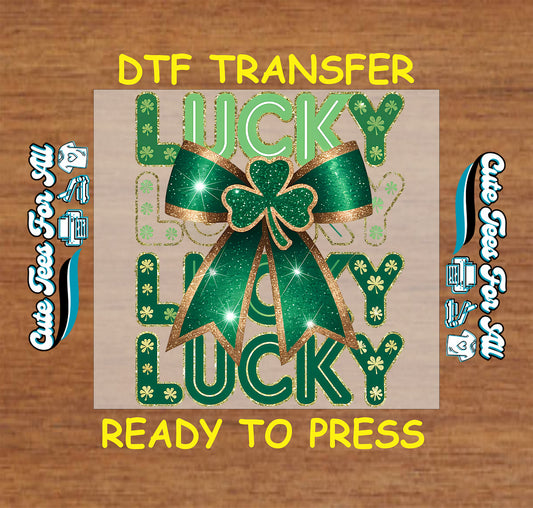 ready to press dtf transfer with lucky lucky lucky text and bow shamrock artwork, festive St Patricks Day iron on heat transfer