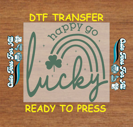 ready to press dtf transfer with happy go lucky text, rainbow arc, and shamrock accent for St Patricks Day DIY shirts