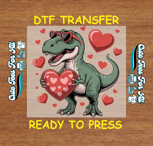 Ready to press dtf transfer featuring a cartoon dinosaur holding a heart with heart sunglasses and floating hearts for Valentines Day DIY shirts