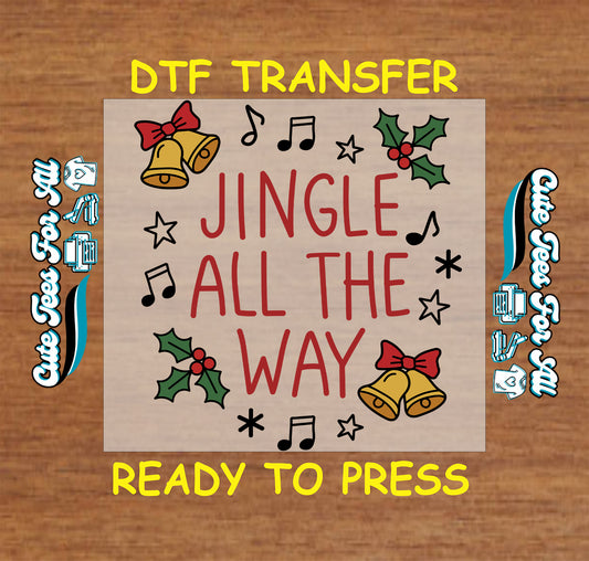 Ready to press dtf Christmas transfer with “Jingle All The Way” text, bells, holly leaves, music notes, and star accents for DIY Christmas shirts.