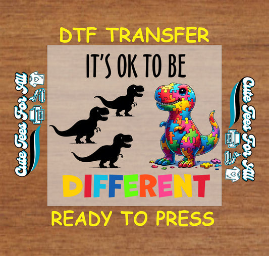 Ready to press dtf autism transfer with colorful puzzle dinosaur and it’s ok to be different text