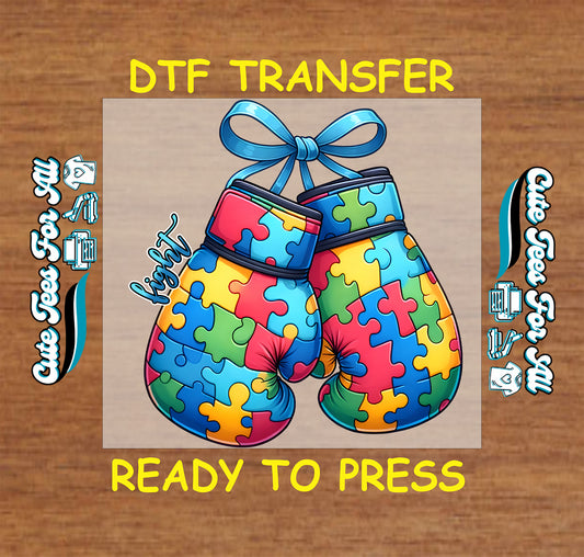 Ready to press dtf autism transfer with puzzle boxing gloves tied with blue ribbon and fight text