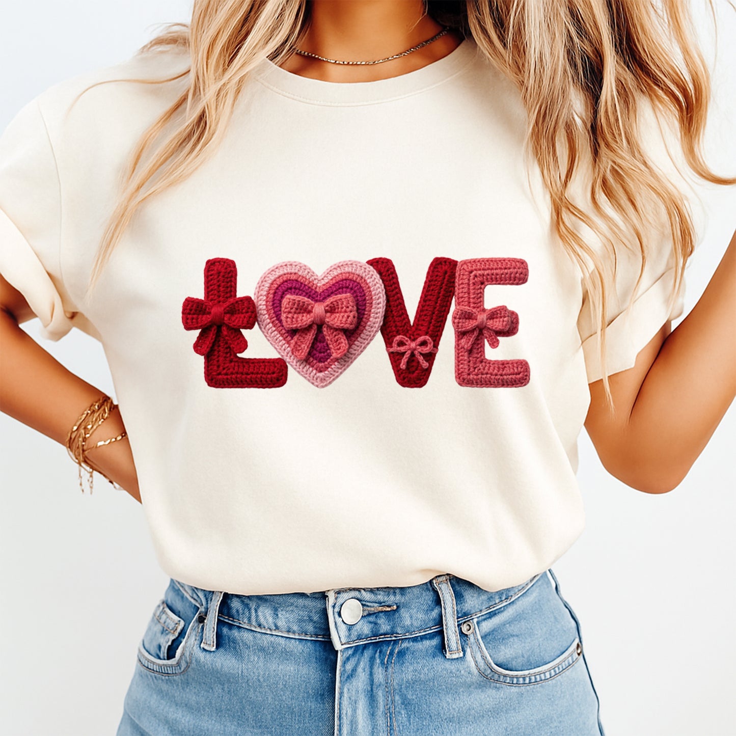 Person wearing a white t-shirt with 'LOVE' text design, standing against a plain background