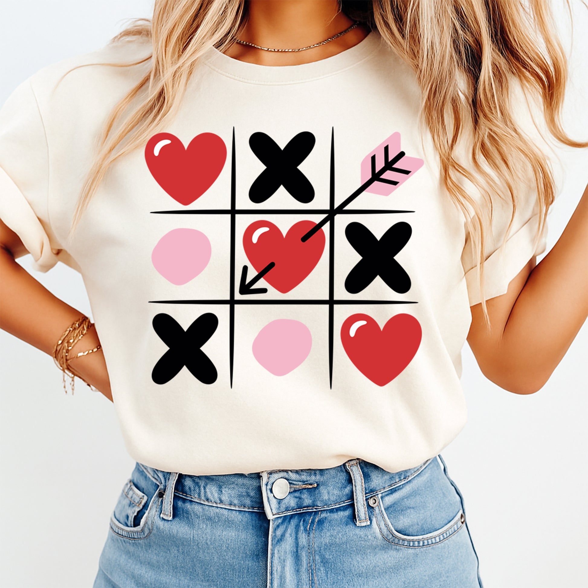 women wearing shirt with heart tic tac toe arrow design