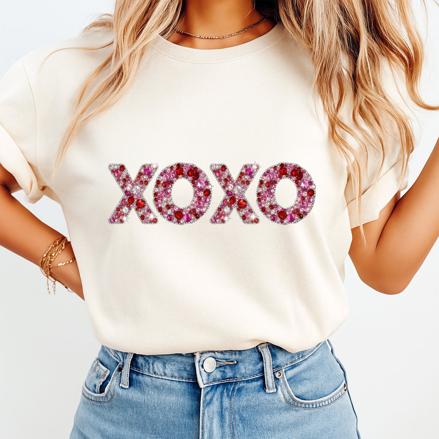 women wearing shirt with xoxo rhinestone style design