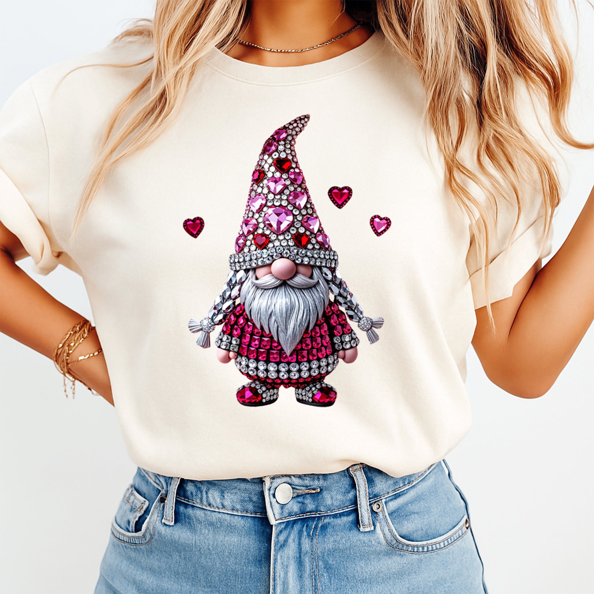 woman wearing cream shirt with valentine gnome ready to press dtf transfer featuring rhinestone heart hat gemstone details and festive heart accents