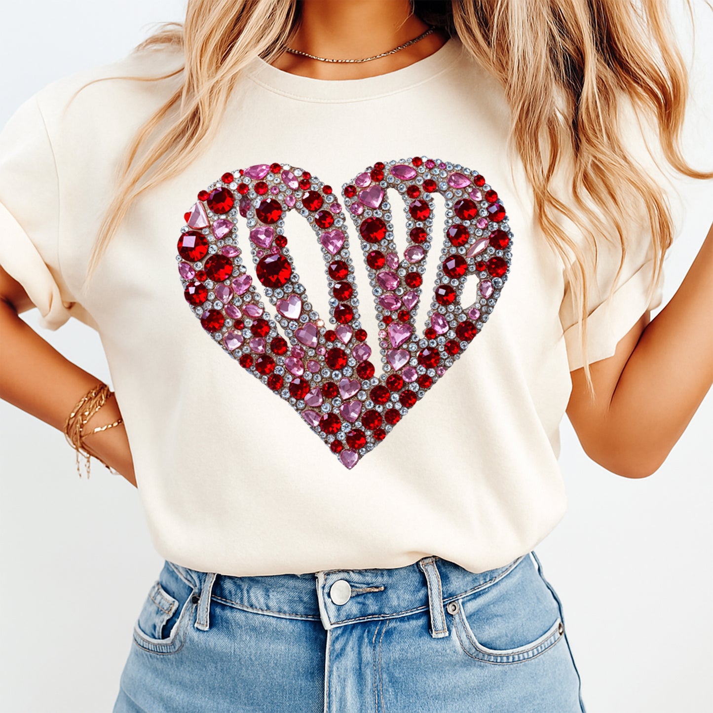 woman wearing cream shirt with valentine rhinestone heart ready to press dtf transfer featuring red and pink crystal gem love design