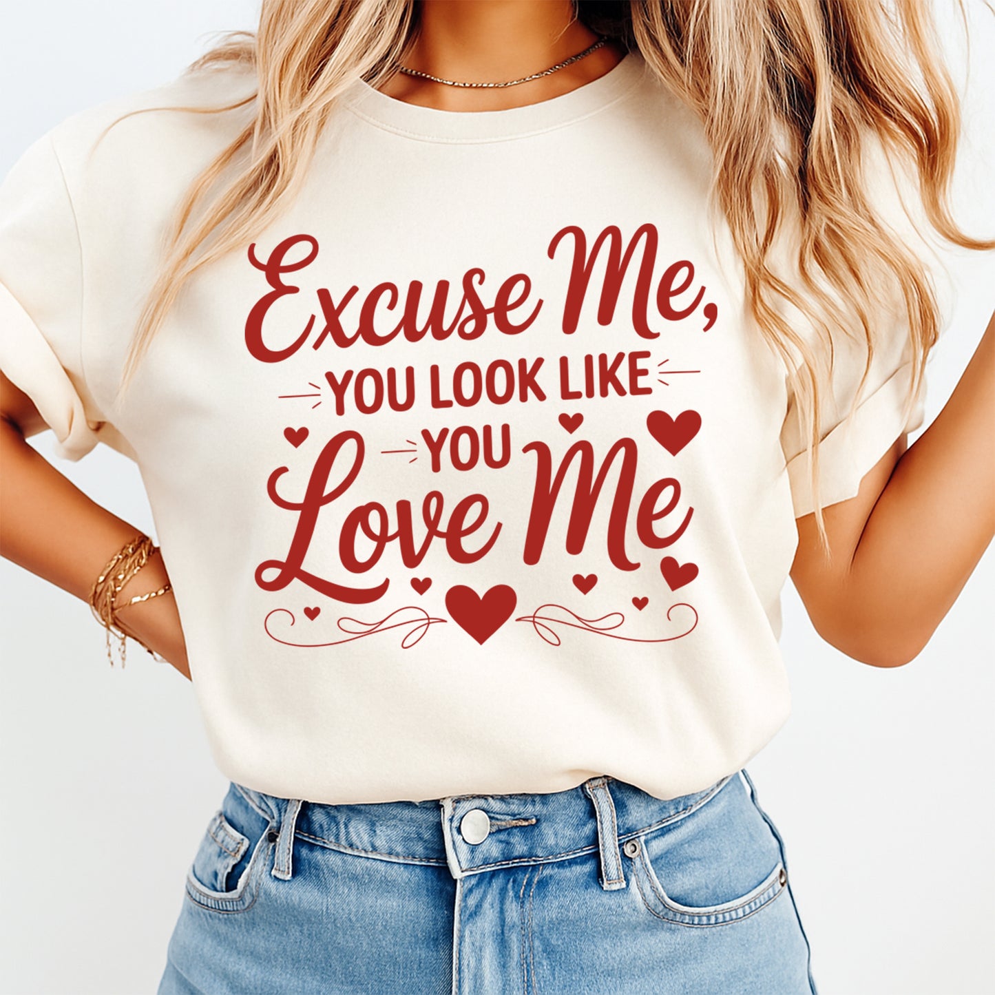 Cream t shirt mockup showing Valentine’s Day Excuse Me You Look Like You Love Me red quote graphic with heart accents on the front