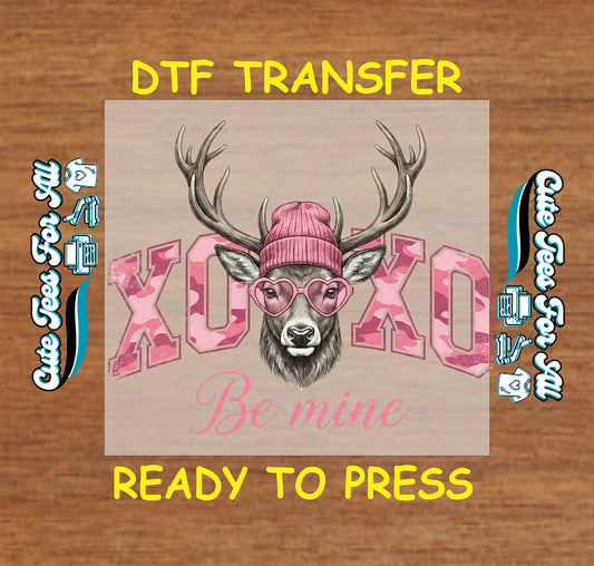 Valentine’s Day ready to press dtf transfer featuring XOXO Be Mine text with deer wearing pink beanie and heart glasses, iron on heat transfer artwork