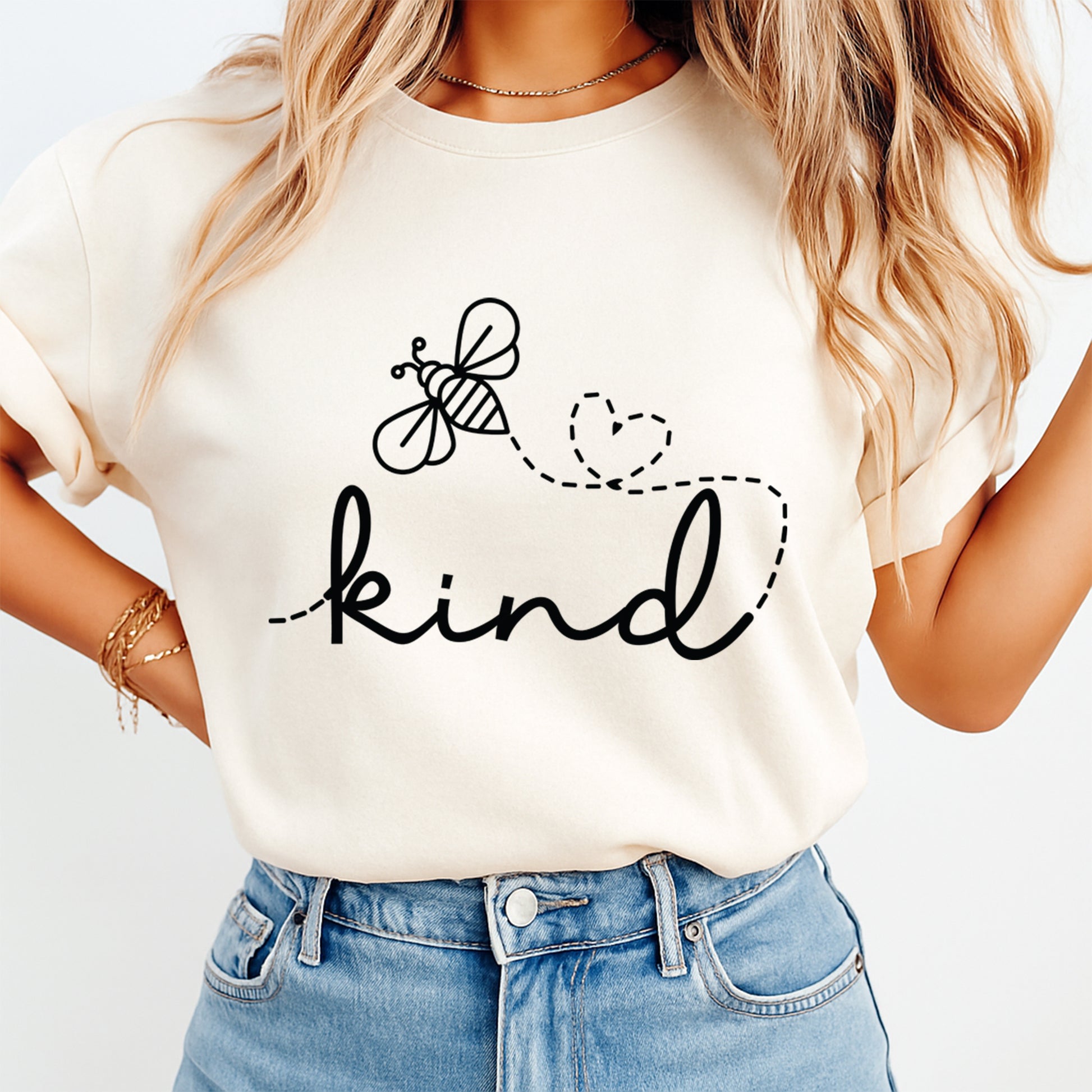 cream shirt mockup showing kind script with bee and heart flight path graphic
