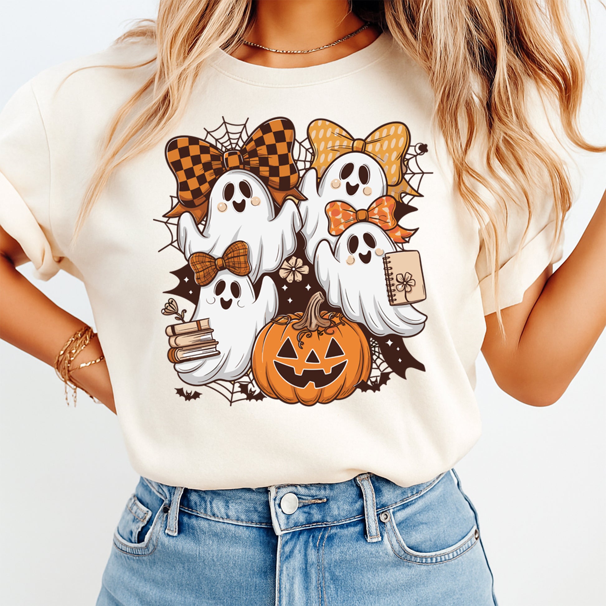 Halloween ghost shirt mockup showing stacked ghost illustration with bows pumpkin and autumn accents on light colored tee