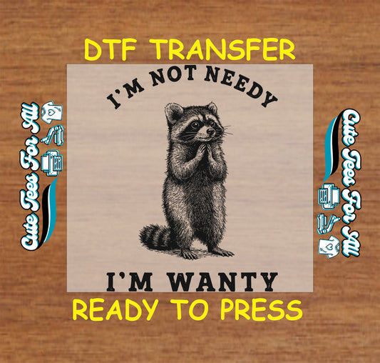 Funny ready to press dtf transfer with I’m Not Needy I’m Wanty text and detailed raccoon illustration for DIY sarcastic shirts