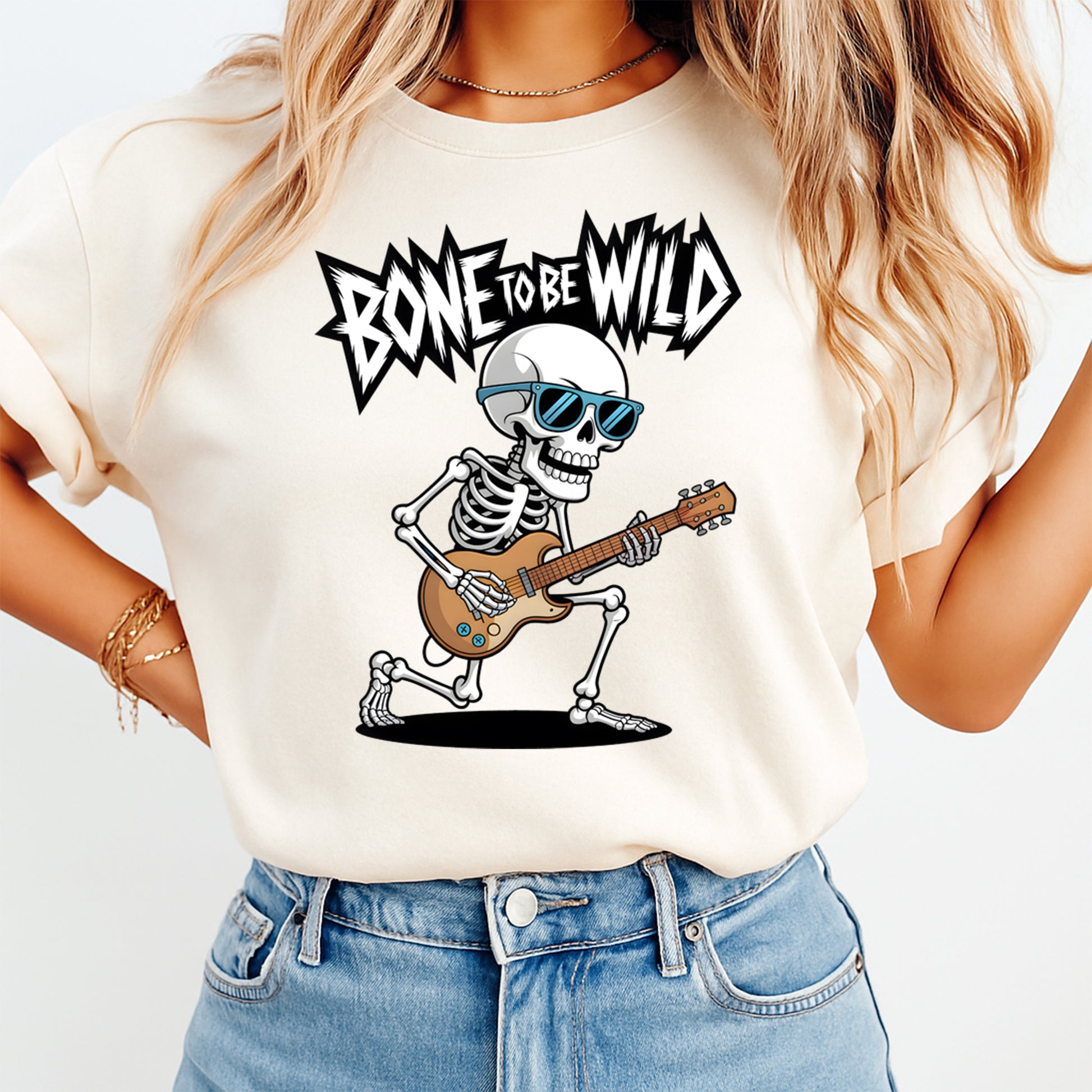 Ready to press dtf transfer shown on light shirt mockup with skeleton guitar graphic and bone to be wild lettering for diy shirts.