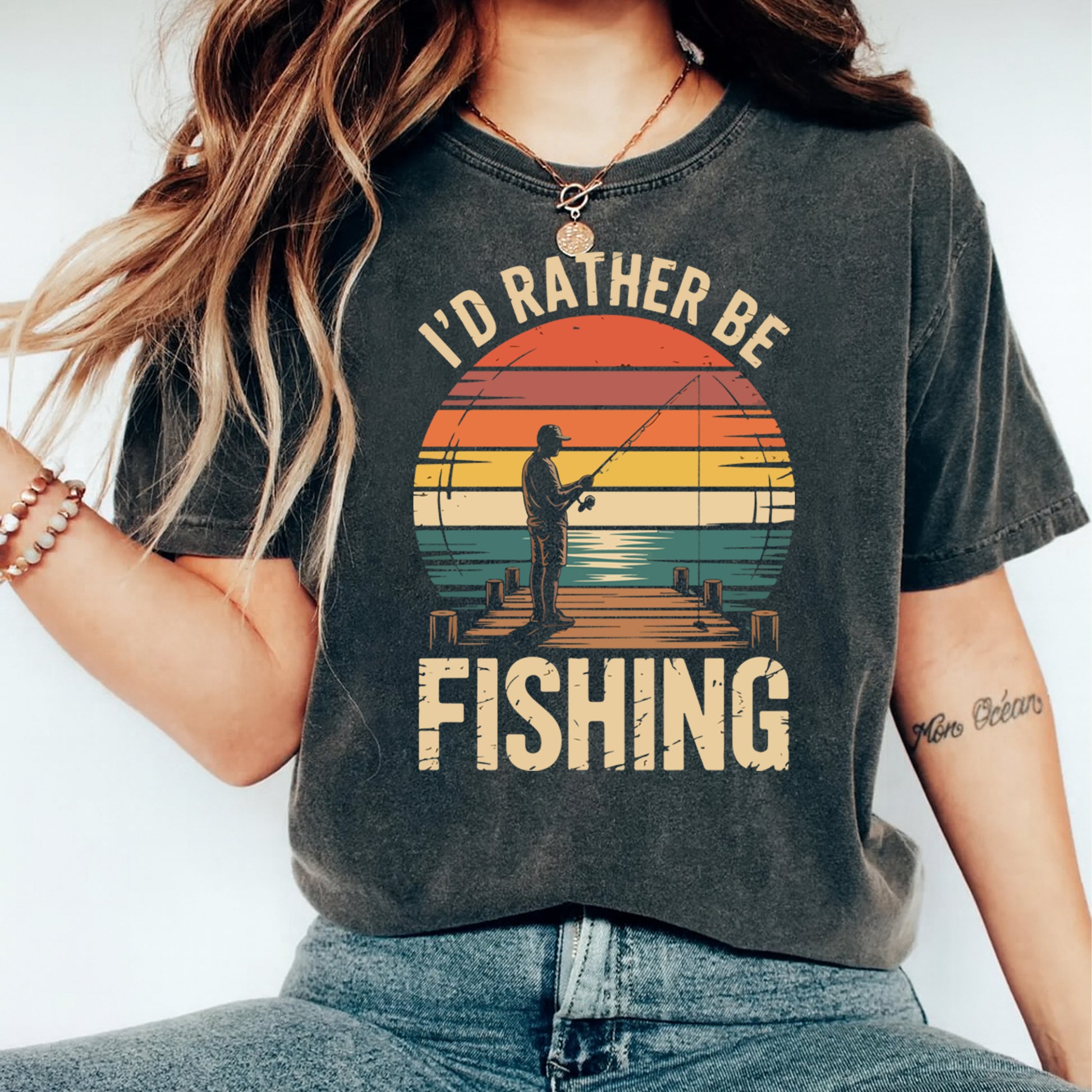 Ready to press dtf transfer shown on dark shirt mockup with retro fishing sunset design and bold outdoor typography.