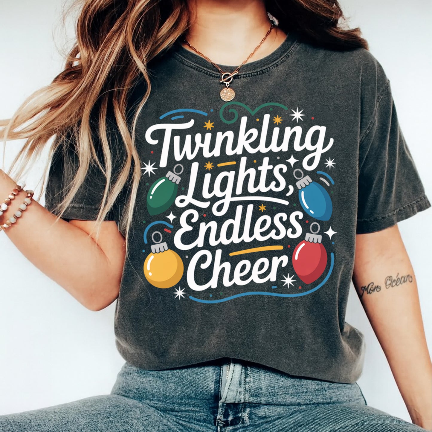 Christmas holiday shirt mockup showing Twinkling Lights Endless Cheer festive typography with colorful string lights on dark apparel