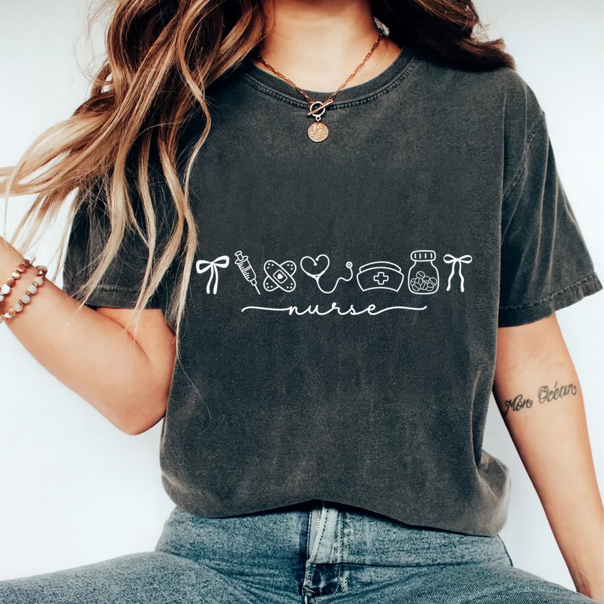 Nurse shirt mockup featuring white line art nurse icons and script design for diy nurse shirts