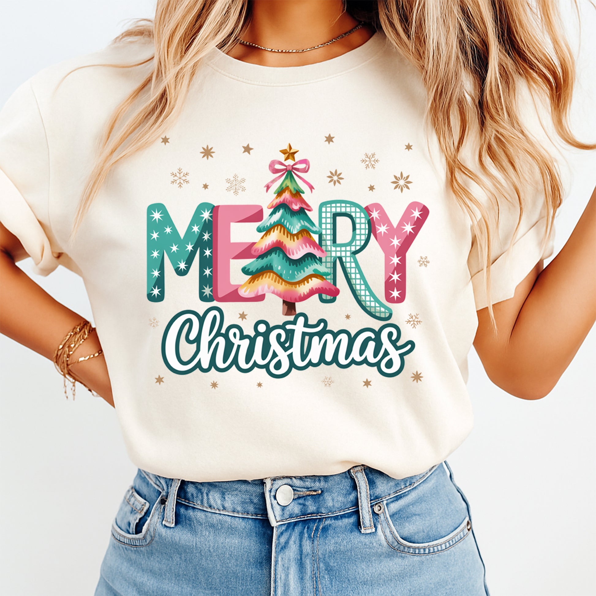Christmas shirt mockup featuring Merry Christmas tree lettering with snowflake accents pressed on a cream short sleeve t shirt