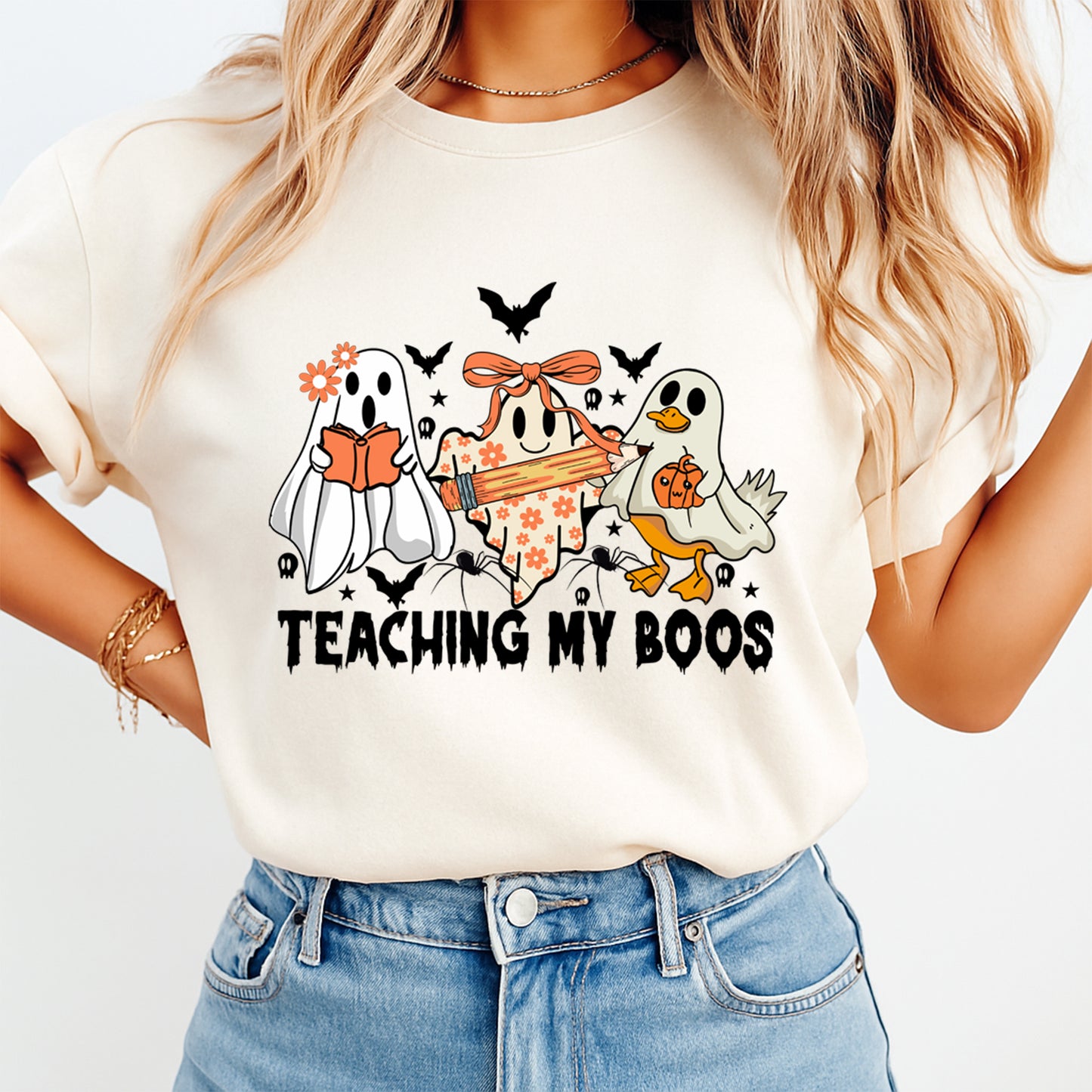 Teaching My Boos halloween ghost teacher graphic displayed on shirt mockup for fall classroom apparel