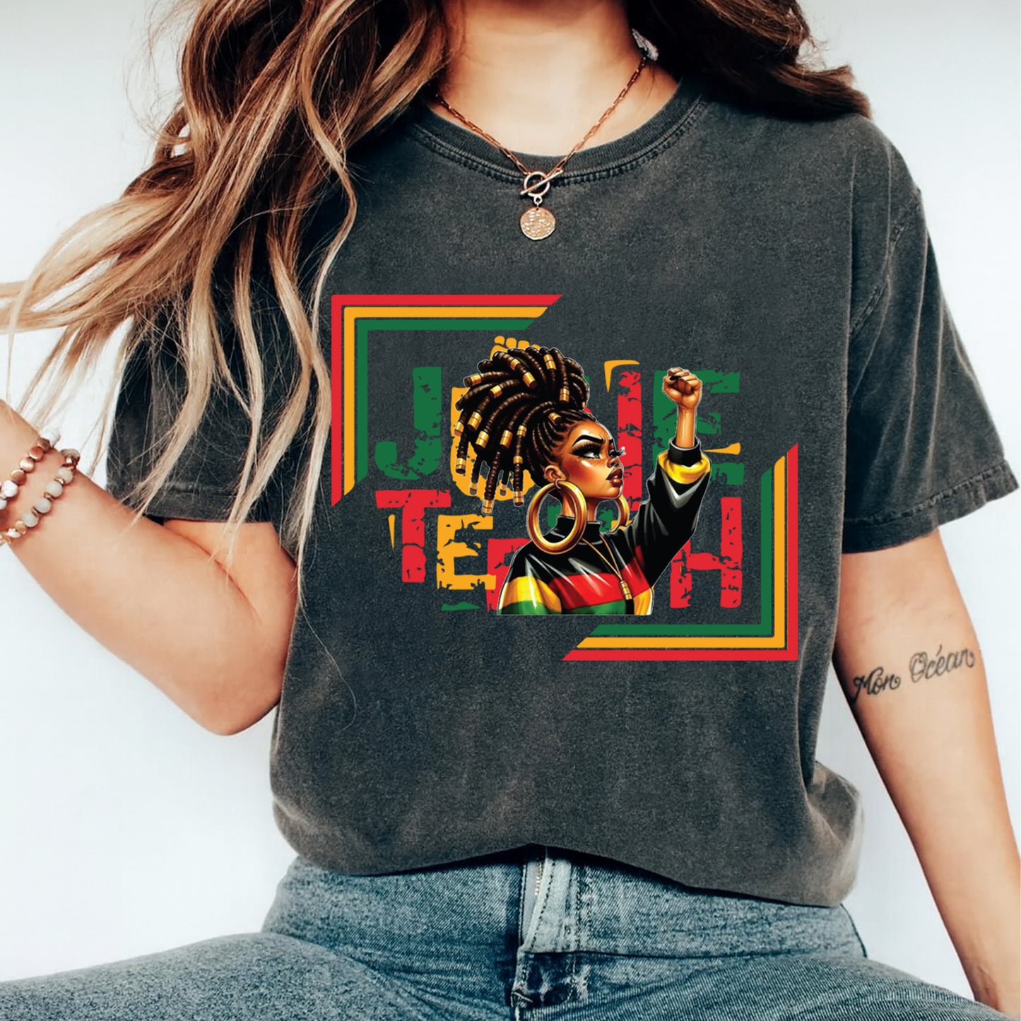 Juneteenth afro woman power fist graphic displayed on black t shirt mockup featuring red black green cultural artwork