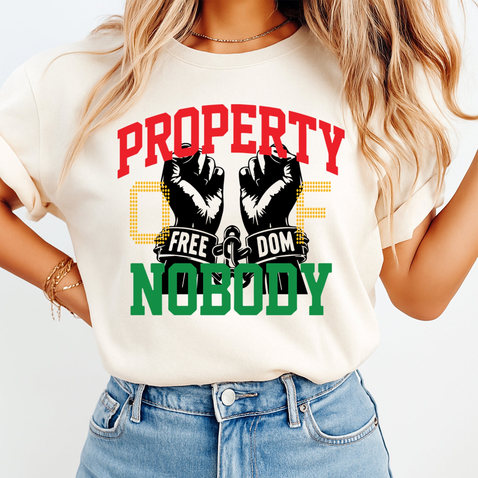 Juneteenth property of nobody freedom hands design displayed on light color t shirt mockup with bold liberation artwork