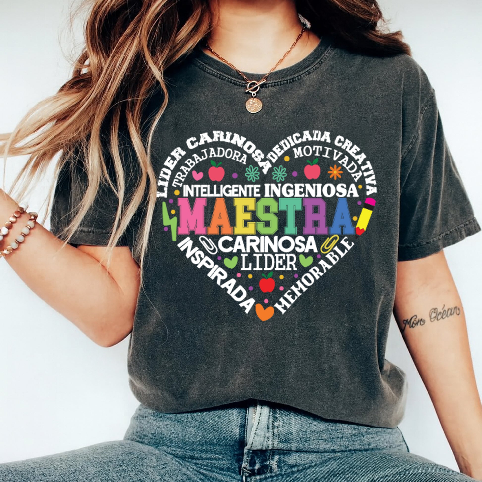 Maestra Spanish heart word art design displayed on dark t shirt mockup with colorful bilingual teacher artwork