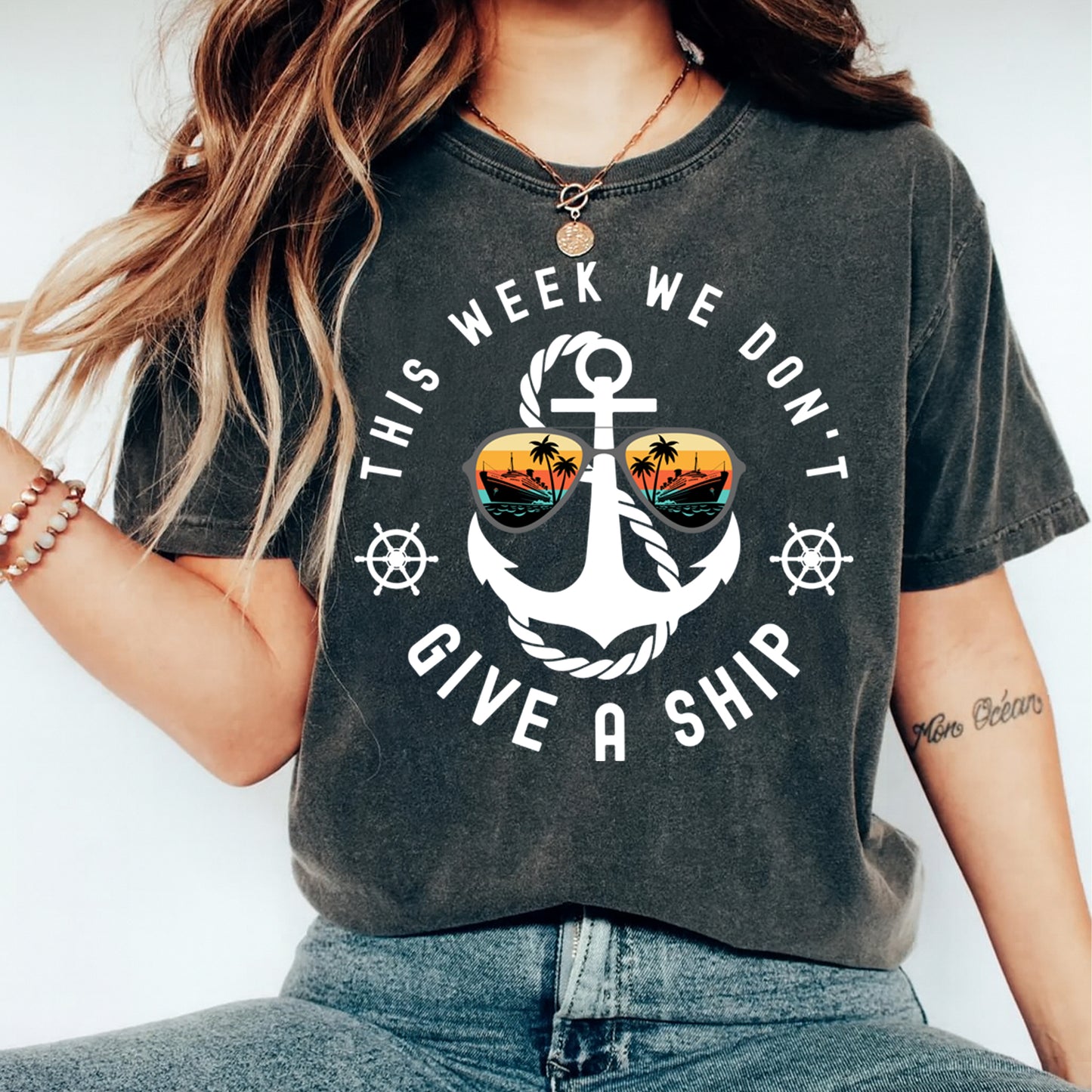 Funny summer anchor quote graphic with sunset sunglasses displayed on dark t shirt mockup for beach and cruise apparel