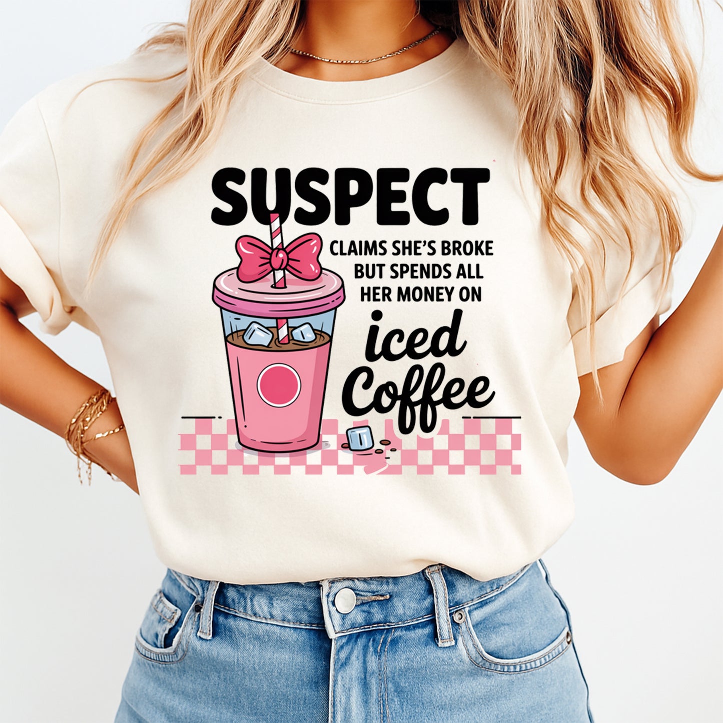 Woman wearing iced coffee lover shirt with Suspect claims she’s broke quote and pink coffee cup graphic tee