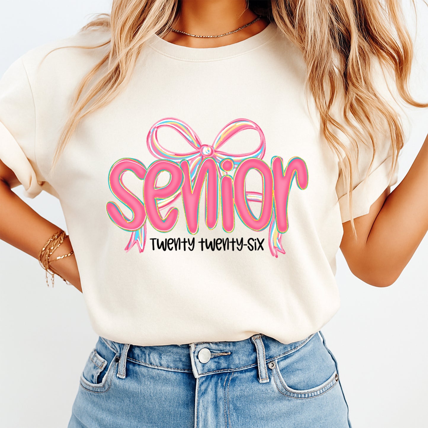 Woman wearing senior twenty twenty six shirt with pink bow graduation graphic design